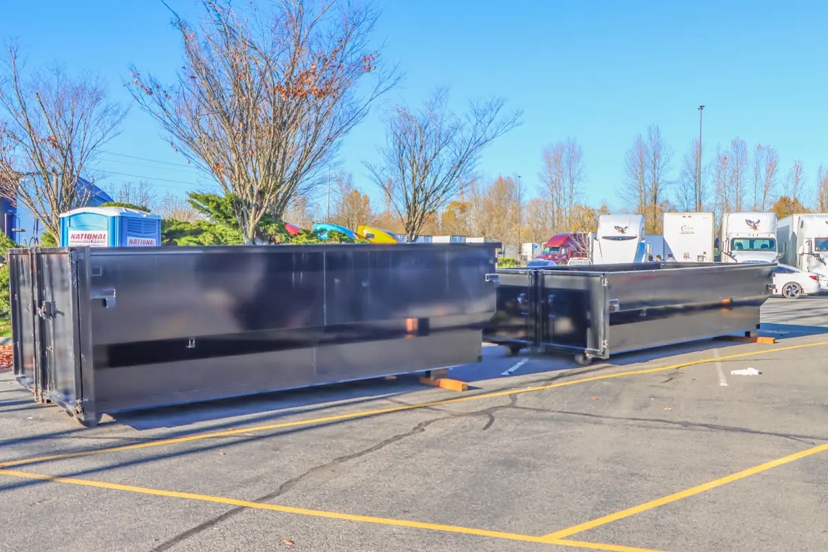 Professional dumpster rental service with roll-off container on residential driveway in Georgetown